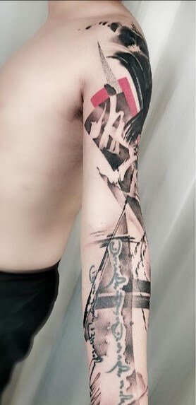 Wu Shang artwork arm tattoo